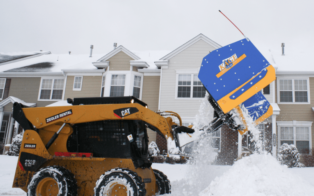 Kage snow plow on CAT skid steer