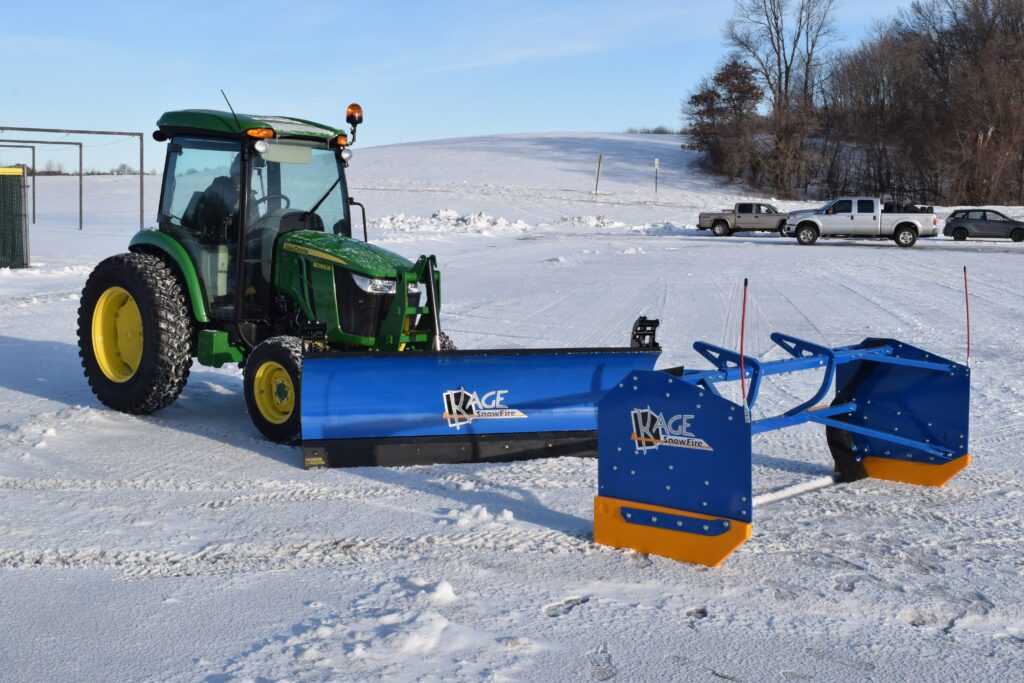 kage blue snow plow snow fire on john deere tractor