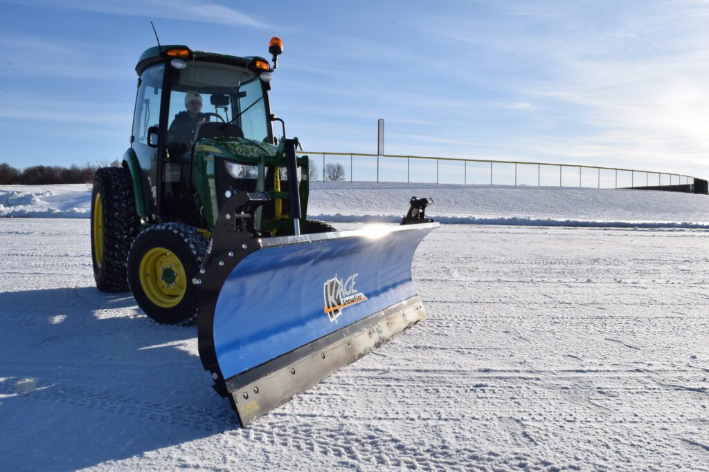 kage blue snow plow snow fire on john deere tractor