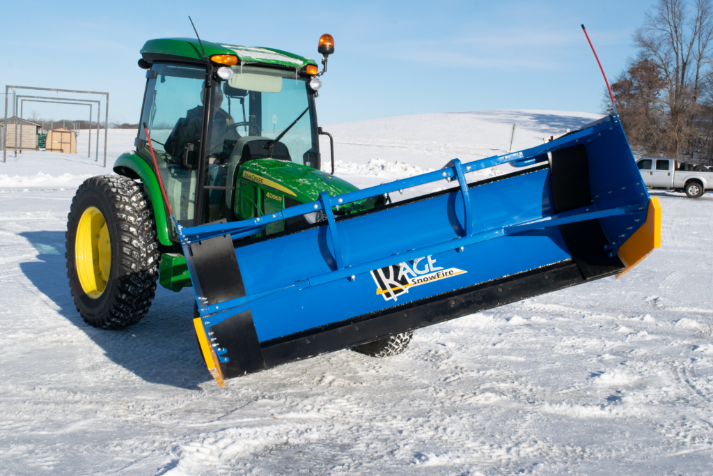 kage blue snow plow snow fire on john deere tractor