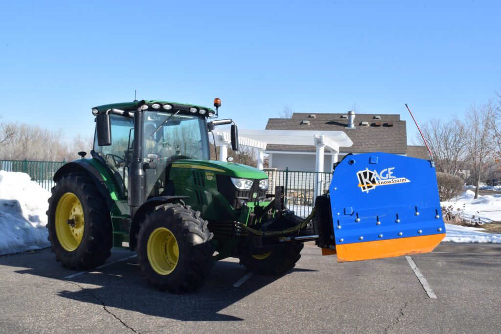 kage blue snow plow snowstorm on john deere tractor