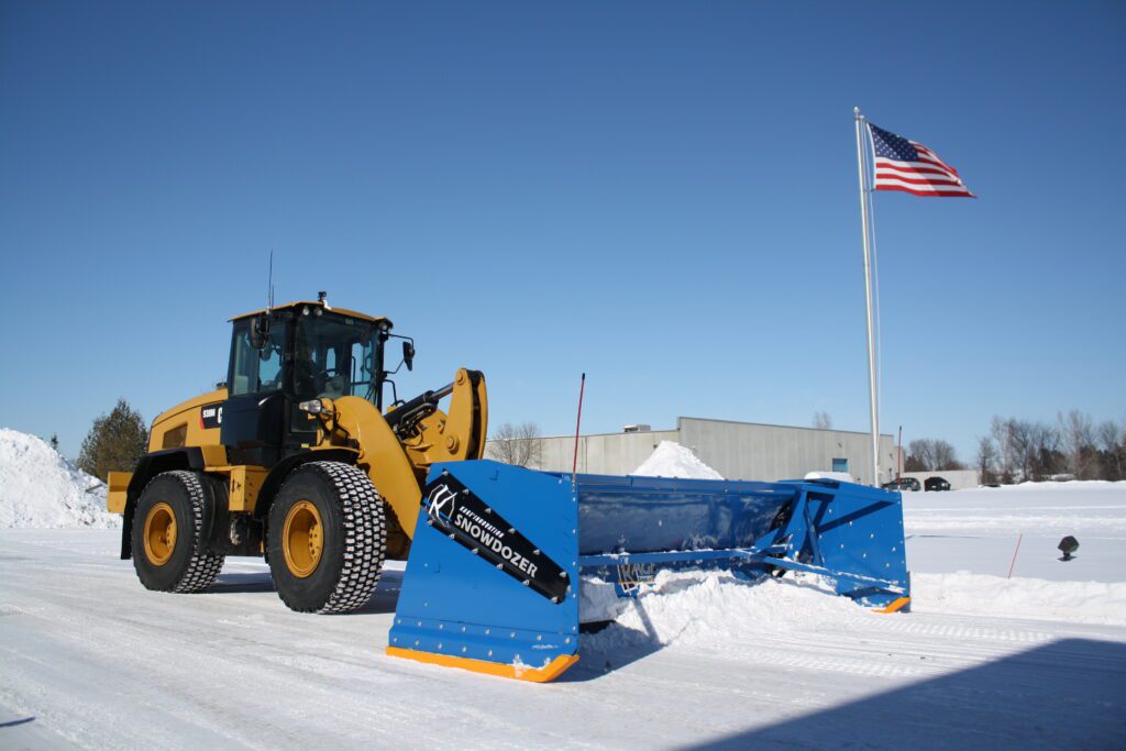 kage blue snow plow snowdozer system on large cat wheel loader