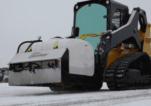 de-icing spray on track loader