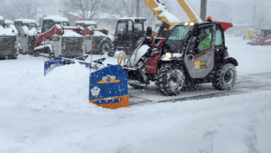 Manitou telehandler plowing snow with KAGE SnowFire