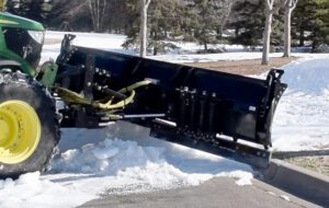 Snowstorm trip edge plow against curb