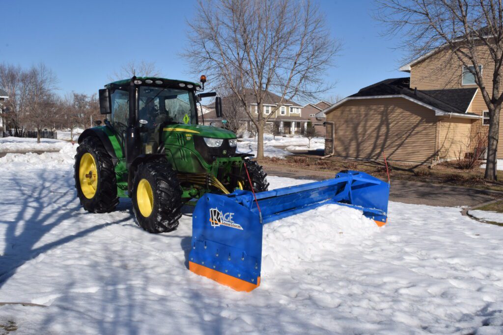 SnowStorm Tractor  Snow Plow pushing snow