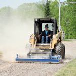 Gravel driveway grader on a John Deere skid steer