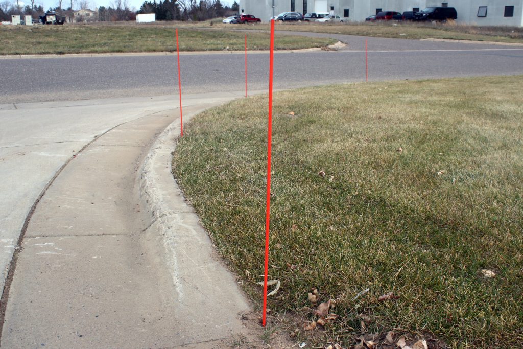 Snow Stakes Installed Against Curb