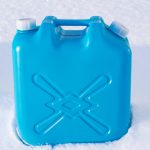 Blue kerosene tank placed on snow