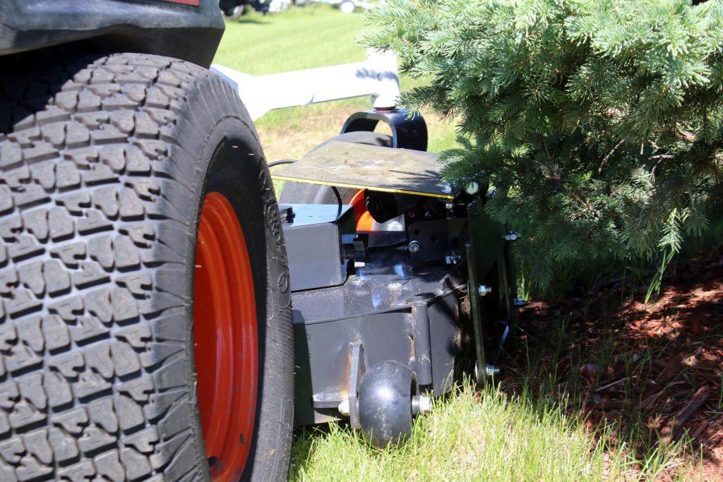 Grass Deflector Flap going under spruce tree