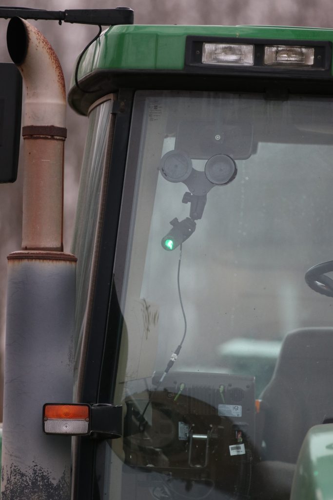 Laser Tractor Guidance System Mounted to Windshield