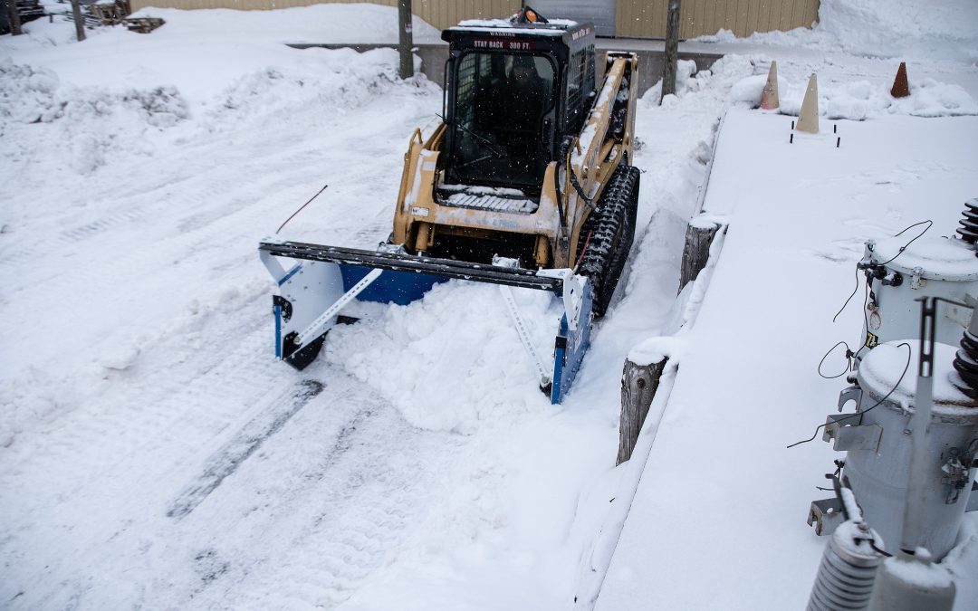 What are the challenges of clearing snow from a loading dock?